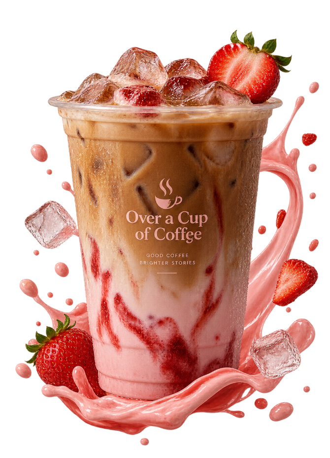 Strawberry iced coffee in a clear cup with ice, fresh strawberries and a pink cream swirl